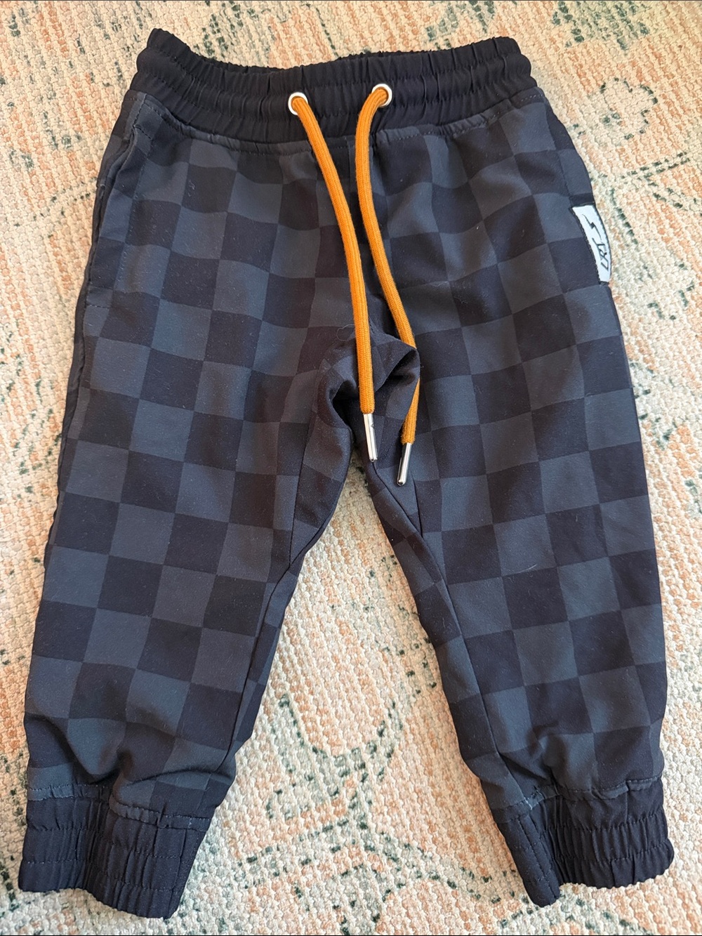 Kids Black Checkered Joggers with Orange Drawstring